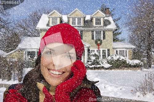 Image of Smiling Mixed Race Woman in Winter Clothing Outside in Snow