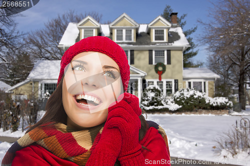 Image of Smiling Mixed Race Woman in Winter Clothing Outside in Snow