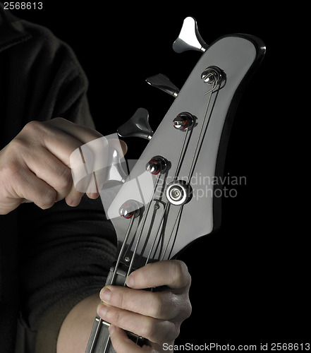 Image of bass guitar tuning