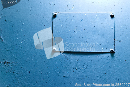 Image of blue steel texture with an old sign for your message