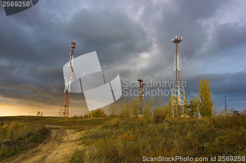 Image of phone towers against the evening sky