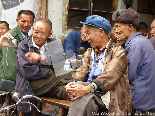 Image of old men looking at their own image