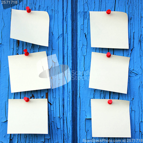 Image of reminder notes, blue wood background with space for your message