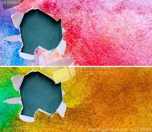 Image of torn assortment ripped blue green yellow red paper against color