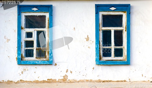 Image of two windows old clay wall