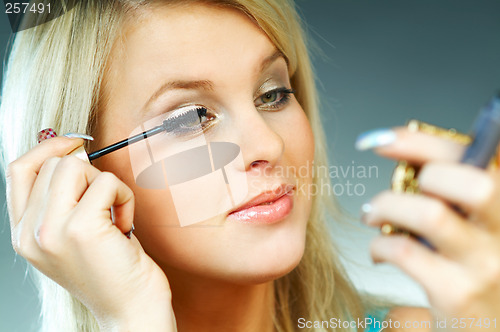 Image of Girl doing makeup