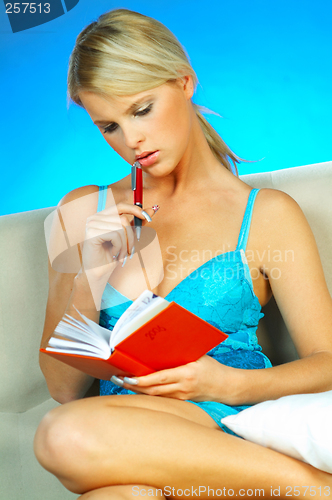 Image of Blonde woman with datebook