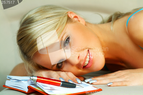 Image of Blonde woman with datebook