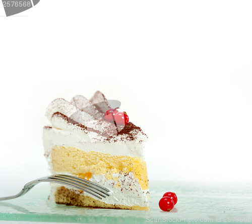 Image of whipped cream and ribes dessert cake slice