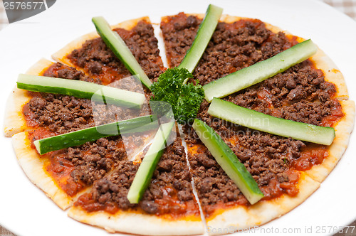 Image of Turkish beef pizza with cucumber on top