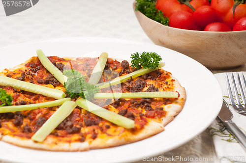 Image of Turkish beef pizza with cucumber on top