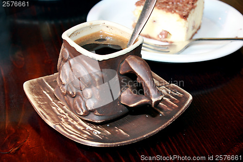 Image of cup of coffee and portion of cake