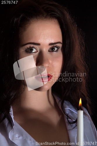 Image of Woman with burning candle