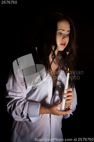 Image of Woman with burning candle