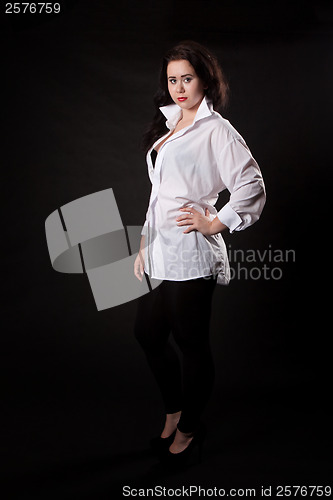 Image of Woman posing in a white men's shirt