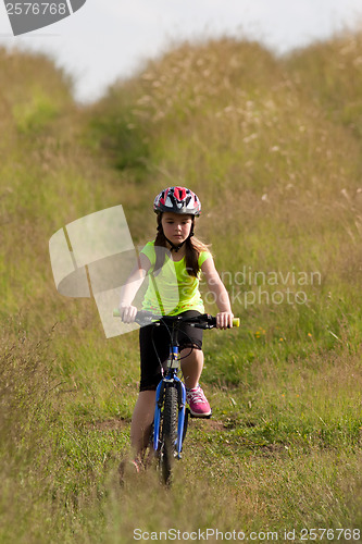 Image of Teens girl on bike