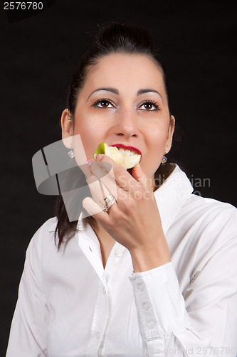 Image of woman eat green apple