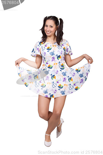 Image of A girl with pigtails in colorful retro dress