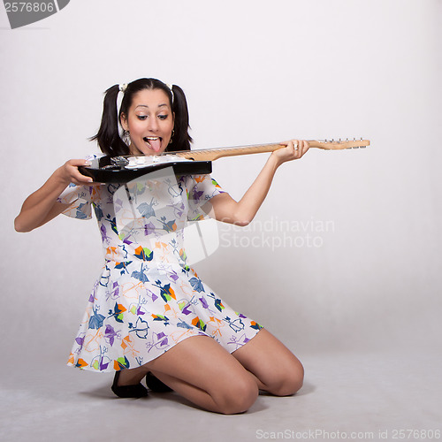 Image of A girl with pigtails in colorful retro dress