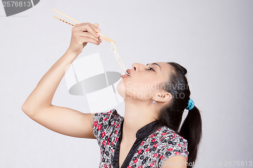 Image of Woman eat noodles