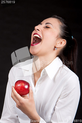 Image of woman eat red apple
