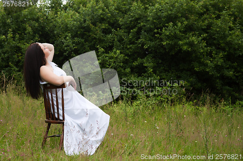 Image of Woman on old chair