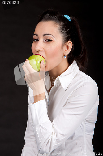 Image of woman eat green apple