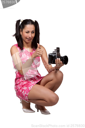 Image of Retro girl in a pink dress