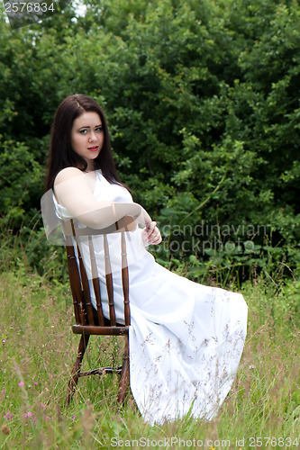 Image of Woman on old chair