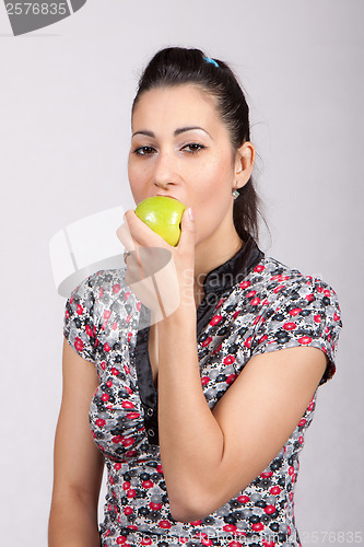 Image of woman eat green apple