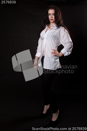 Image of Woman posing in a white men's shirt