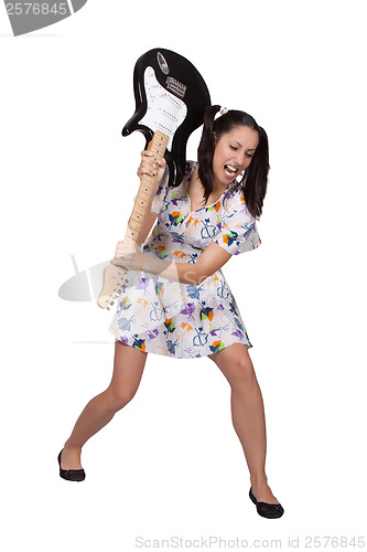 Image of A girl with pigtails in colorful retro dress