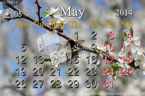 Image of calendar for May of 2014 with blossoming cherry