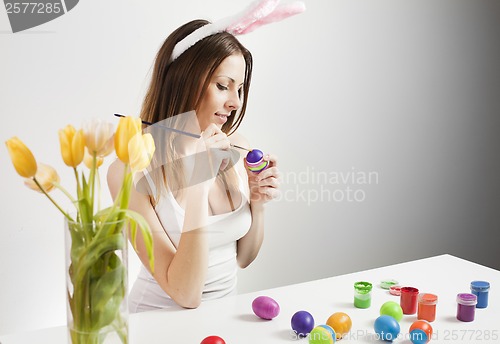 Image of Girl painting easter eggs