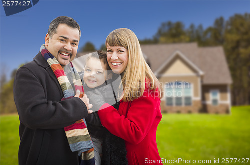 Image of Happy Mixed Race Family in Front of House