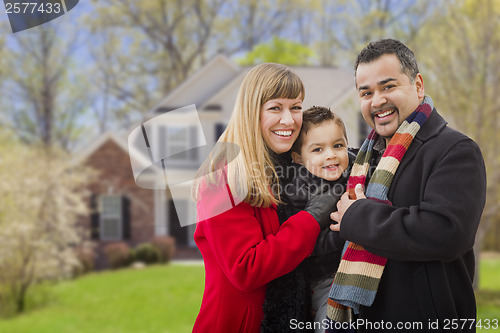 Image of Happy Mixed Race Family in Front of House