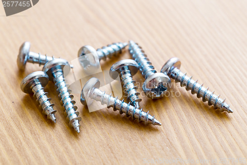 Image of screws on wood