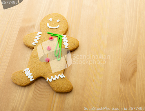 Image of Gingerbread man on wooden background