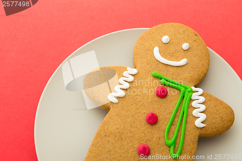 Image of Gingerbread man on red background