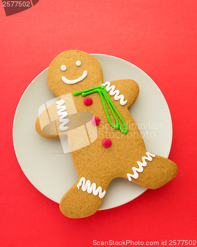 Image of Gingerbread man on red background