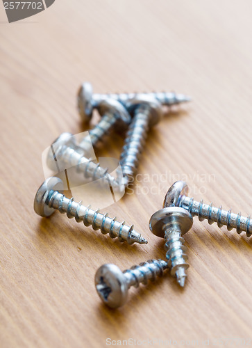 Image of screws on wood