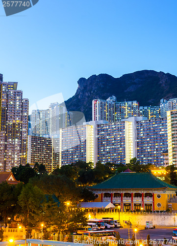 Image of Kowloon side in Hong Kong at night with lion rock