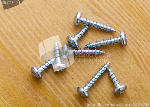 Image of screws on wood