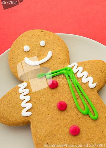 Image of Gingerbread man on red background
