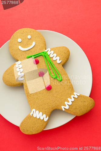 Image of Gingerbread cookie with red background