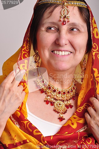 Image of senior woman in traditional Indian clothing and jeweleries