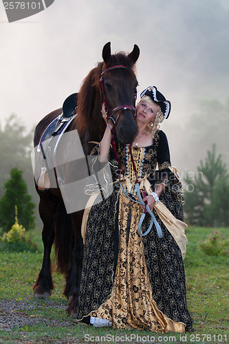 Image of Woman in dress royal baroque riding