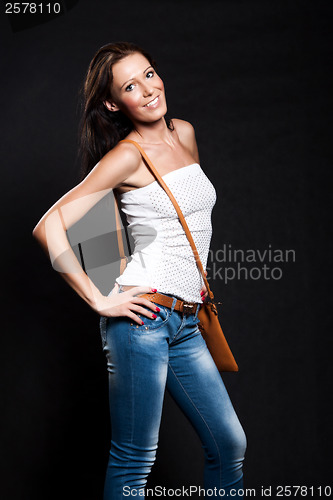 Image of Long-haired woman with handbag