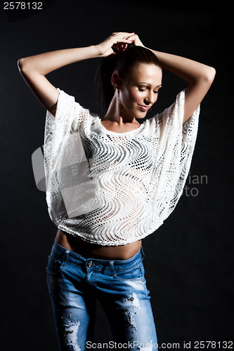 Image of Long-haired woman in white gauze blouse