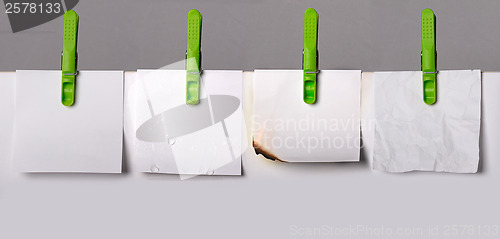 Image of Set of note papers with clothes pegs